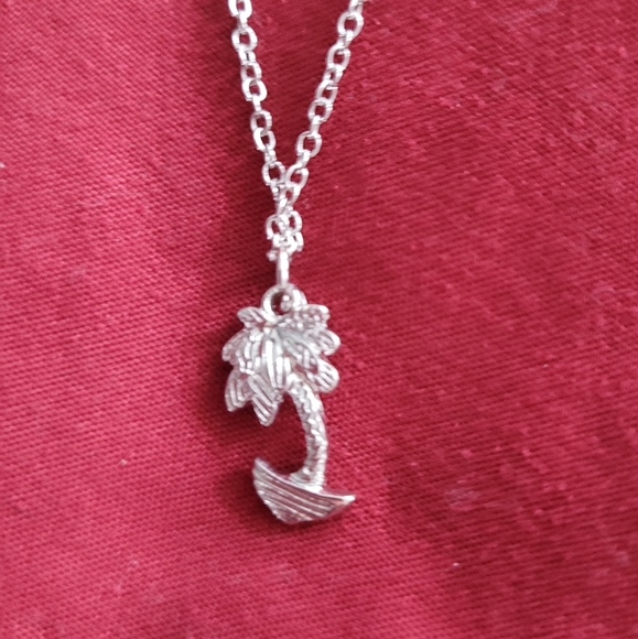 Jewelry - Silver colored necklace with palm tree